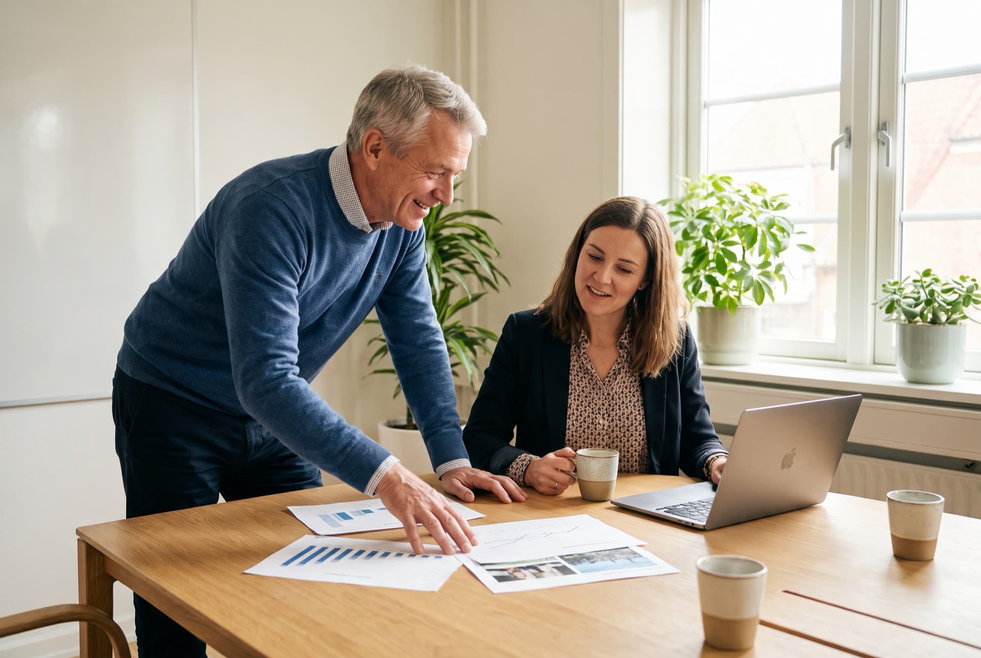 An advisor and a dentist reviewing a practice's financials